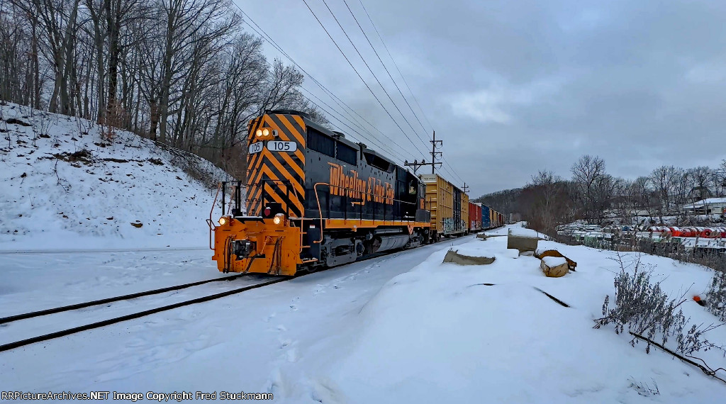 WE 105 leads the train at Gilchrist Rd.